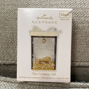 2012 Hallmark keepsake ornament. “The Greatest Gift” Magic (features light).